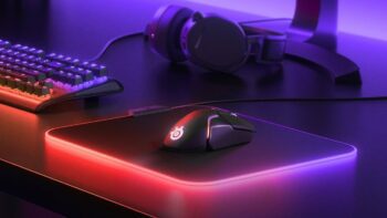 A gaming mousepad with gaming mouse, keyboard and headphones